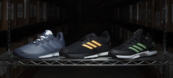 Grouping of adidas tennis shoes. 